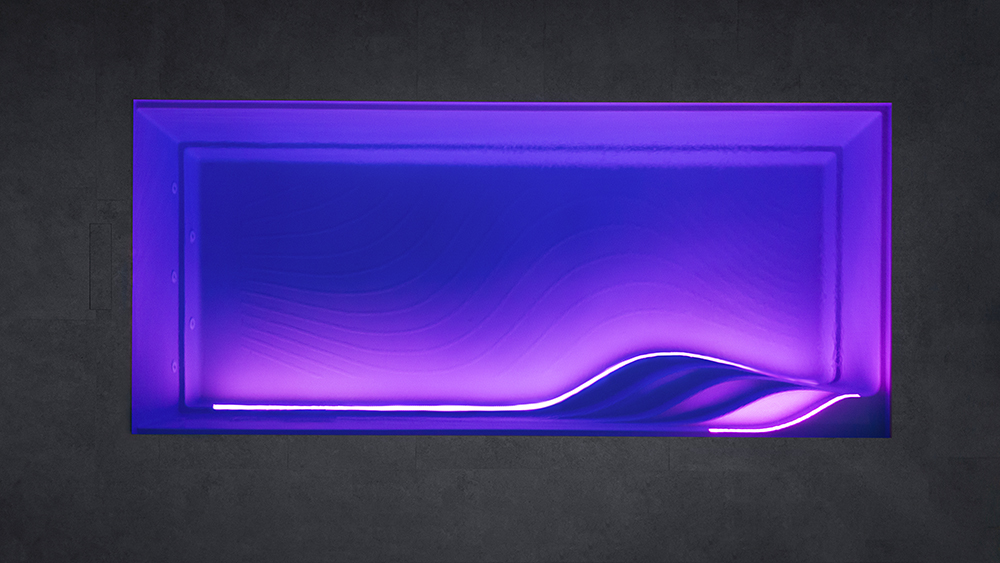 Ein beleuchteter Pool bei Nacht von der Firma WaterRows Industries.